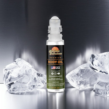 Creed Himalaya Inspired Body Oil Roll-On with grapefruit, bergamot, sandalwood, and musk scent, against icy background.