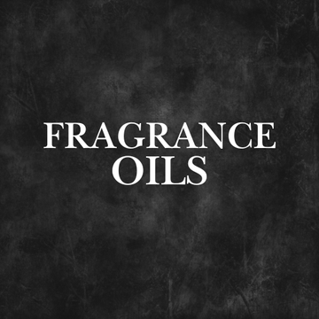 Bottle of premium Fragrance Oils surrounded by aromatic spices and flowers, emphasizing pure and alcohol-free qualities.