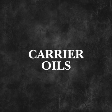 Golden Jojoba 100% Organic Carrier Oil bottle in natural setting with cactus, part of Natural & Organic Carrier Oils collection.