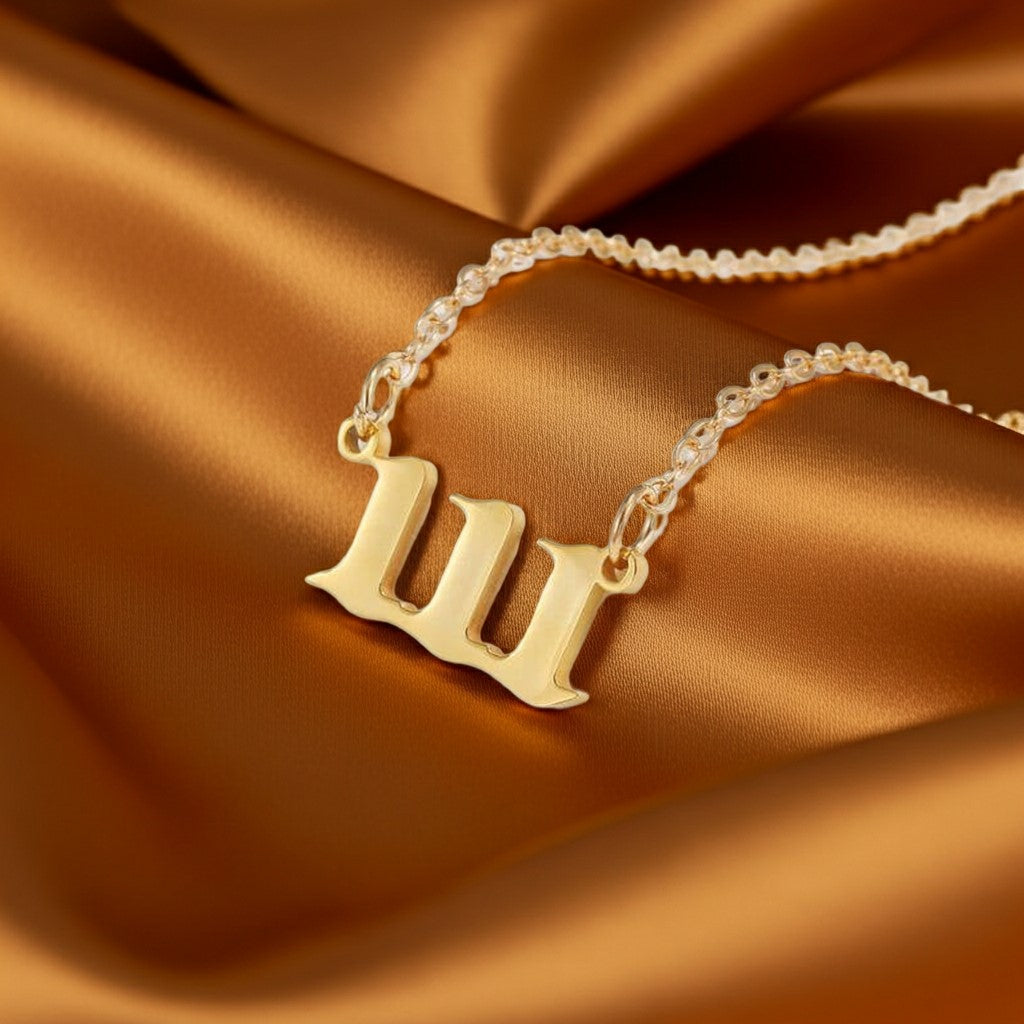 111 angel number gold necklace in stainless steel displayed on satin backdrop for alignment and manifestation jewelry