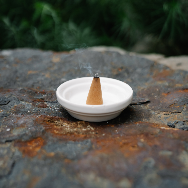 Amber White scented incense cones for natural aromatherapy and relaxation, handcrafted by Ancient Infusions, perfect for meditation and stress relief.