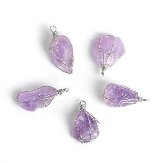 Close-up of Ancient Infusions Amethyst Gemstone Pendant - Serene and Elegant Jewelry. Experience enhanced spiritual awareness and inner peace with the properties of Amethyst.