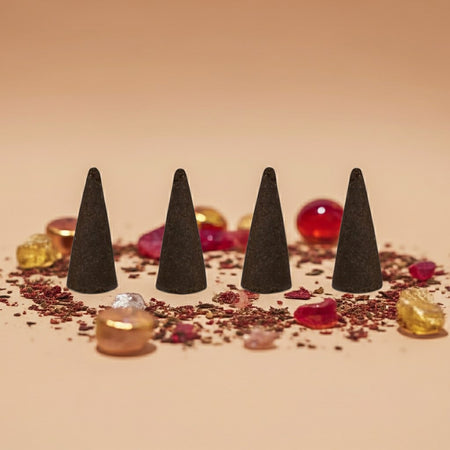 Imported Baccarat Rouge 540 Inspired incense cones on a decorative surface with small colorful objects.