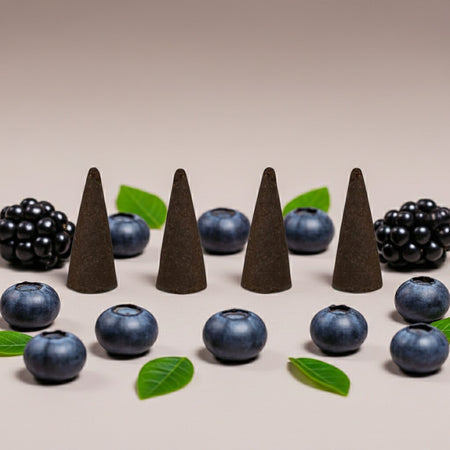 Imported Blueberry Grapes Incense Cones and blueberries arranged on a beige background