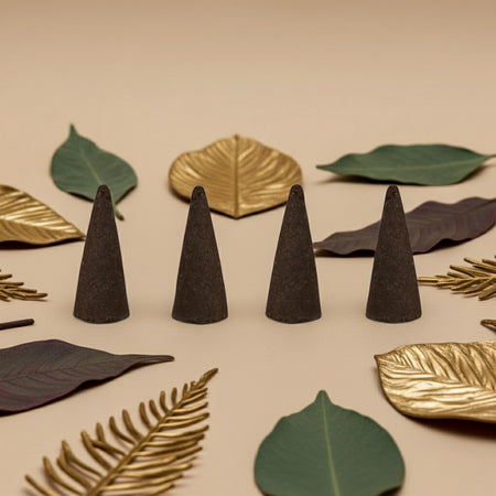 Imported Jannatul Firdaus Incense Cones with decorative leaves on a beige background