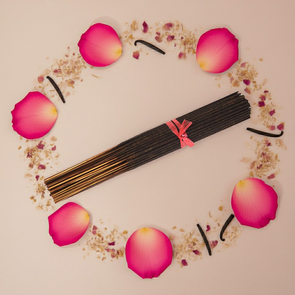 Imported Rose Vanilla Incense Sticks with a pink ribbon surrounded by rose petals on a beige background