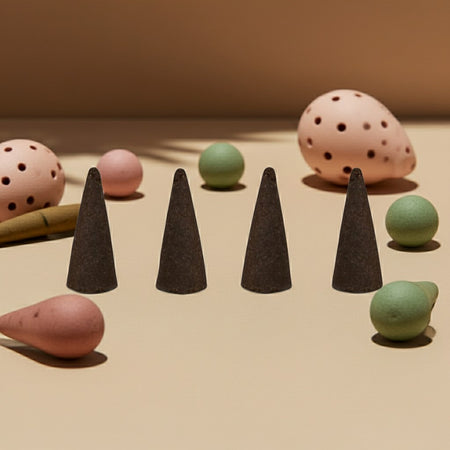 Magnolia Incense Cones and balls on a beige surface