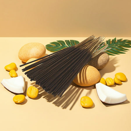 Pina Colada Incense Sticks with coconut pieces and leaves on a beige background