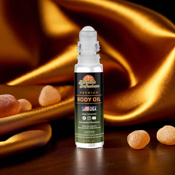 Amber Blue Body Oil Roll-On bottle with warm amber backdrop and ancient infusions label, conveying a sensual and earthy fragrance.