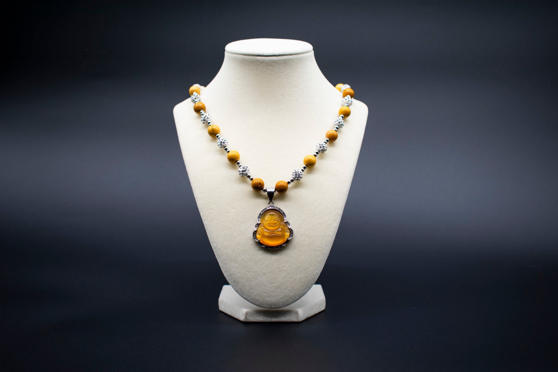 Ancient Infusions Custom Beaded Mookaite Necklace with Laughing Buddha pendant, handcrafted with genuine crystals to promote joy, abundance, and positive energy.