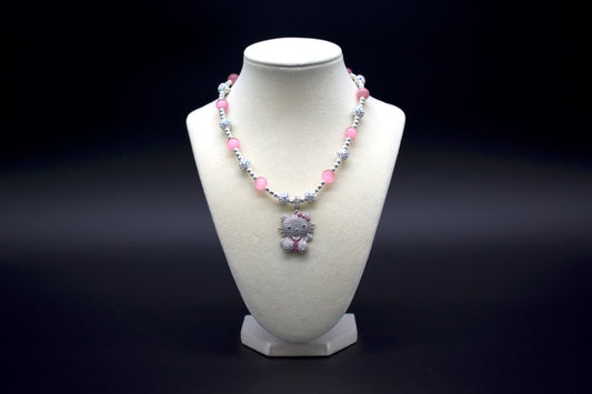 Ancient Infusions Custom Beaded Pink Cat’s Eye Necklace with Hello Kitty pendant, handcrafted with genuine crystals to enhance love, protection, and intuition. Available in multiple lengths.