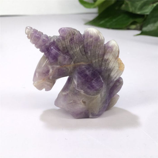 Ancient Infusions Amethyst Crystal Carved Unicorn - A symbol of elegance and spiritual calmness at ~2 inches tall.