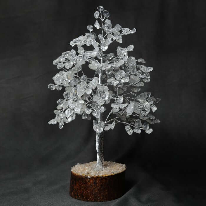 Experience tranquility with Ancient Infusions' Clear Quartz Crystal Tree - hand-wired with 300 crystal pieces to bring balance, harmony, and healing energy to your space.