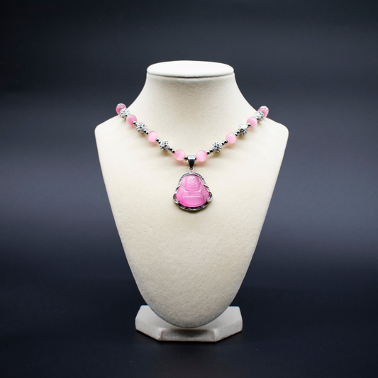 Ancient Infusions Custom Beaded Pink Cat’s Eye Necklace with Laughing Buddha pendant, handcrafted with genuine crystals to promote joy, abundance, and positive energy.