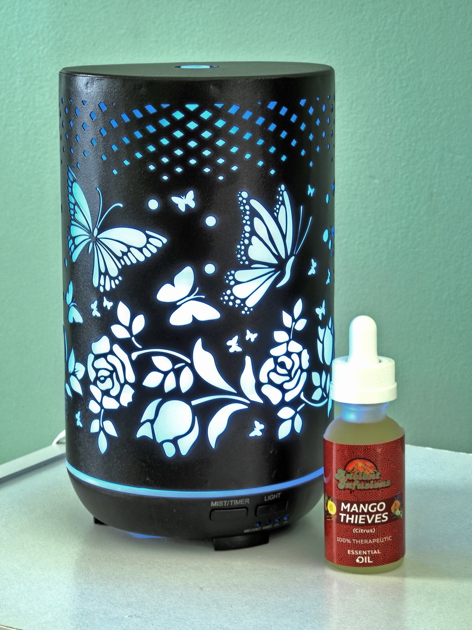Beautiful Aromatherapy Diffuser with Butterflies and Roses Design by Ancient Infusions.