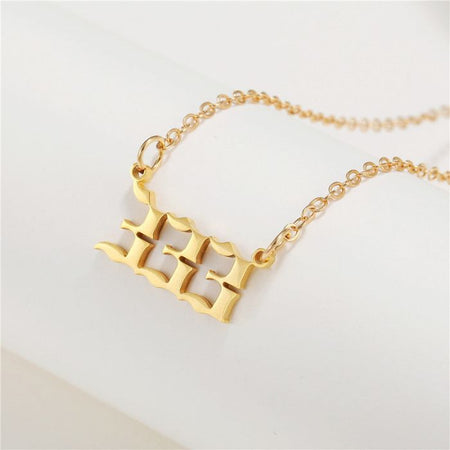 Ancient Infusions stainless steel necklace with Angel Number 333 pendant in gold.