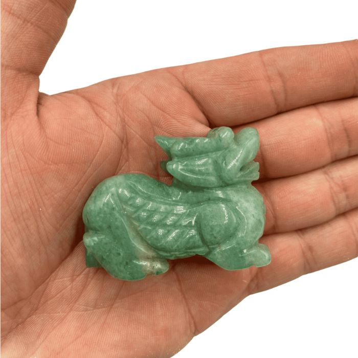 Enchanting Green Jade Crystal Dragon hand-carved by Ancient Infusions, radiating wisdom and prosperity.