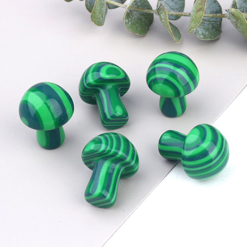 Ancient Infusions Malachite Carved Mushroom - ~0.8 inches of vibrant transformation. Front view showcasing the unique patterns and protective energy of Malachite.