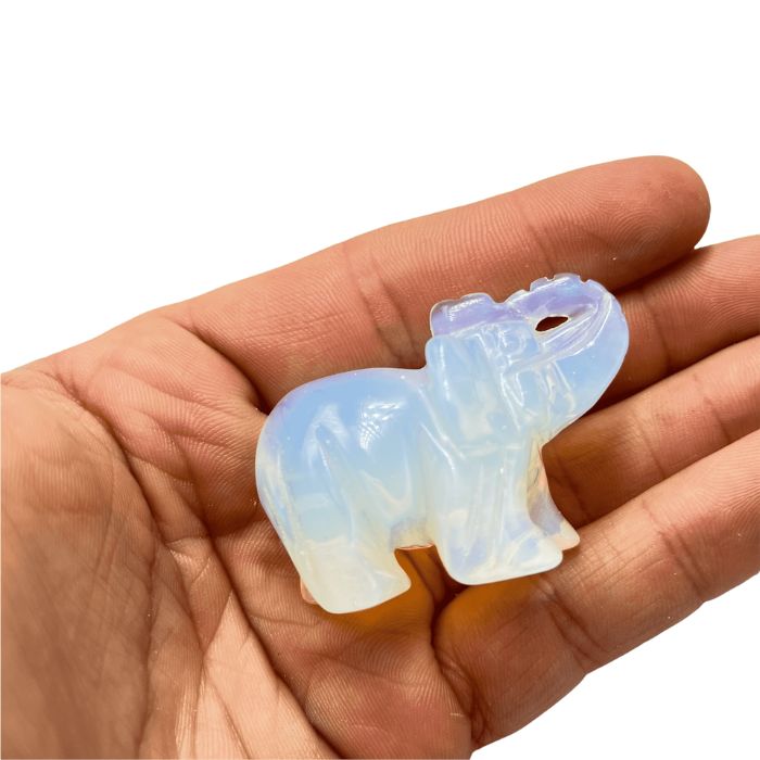 Ancient Infusions Opalite Crystal Carved Elephant - A radiant companion for spiritual illumination and tranquility.