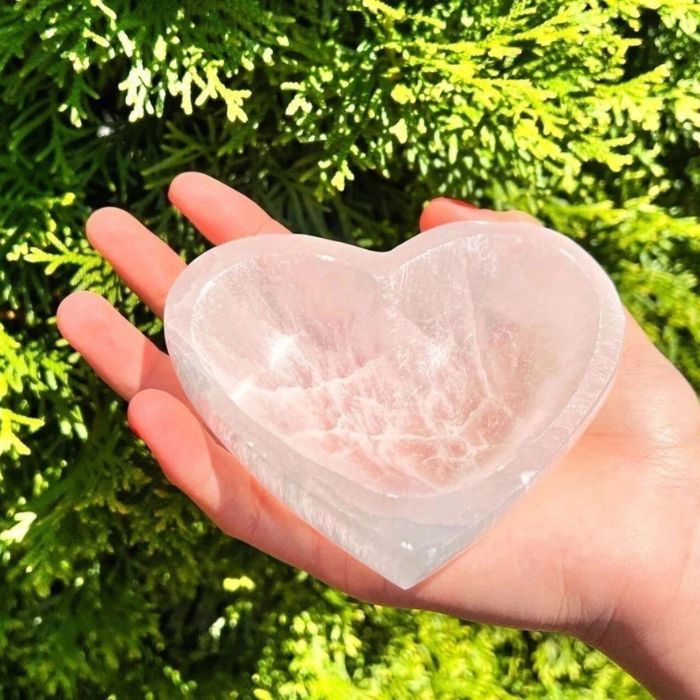 Experience pure serenity with Ancient Infusions' Selenite Heart Bowl, a powerful crystal cleanser for your space.