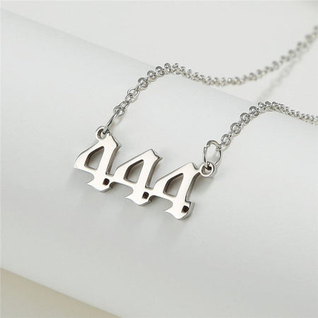 Ancient Infusions stainless steel necklace with Angel Number 444 pendant in silver.