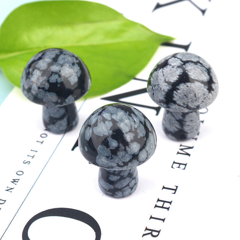 Ancient Infusions Snowflake Obsidian Carved Mushroom - Experience spiritual symmetry and delicate beauty. Front view showcasing the hand-carved perfection and protective energy of Snowflake Obsidian.