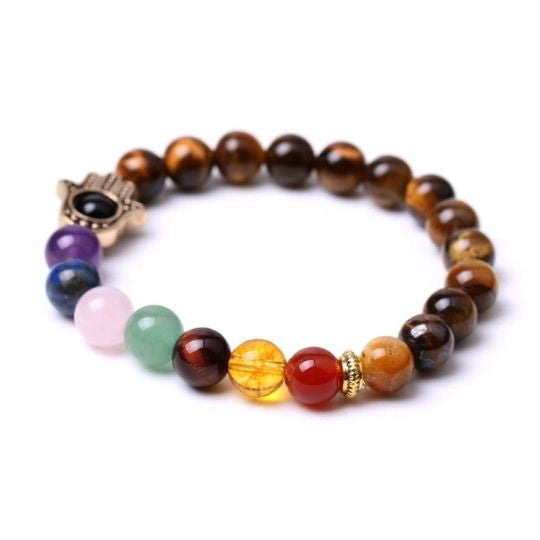 Immerse in the protective and grounding energy of our 7 Chakra Tiger's Eye Hamsa Elastic Crystal Bracelet by Ancient Infusions.