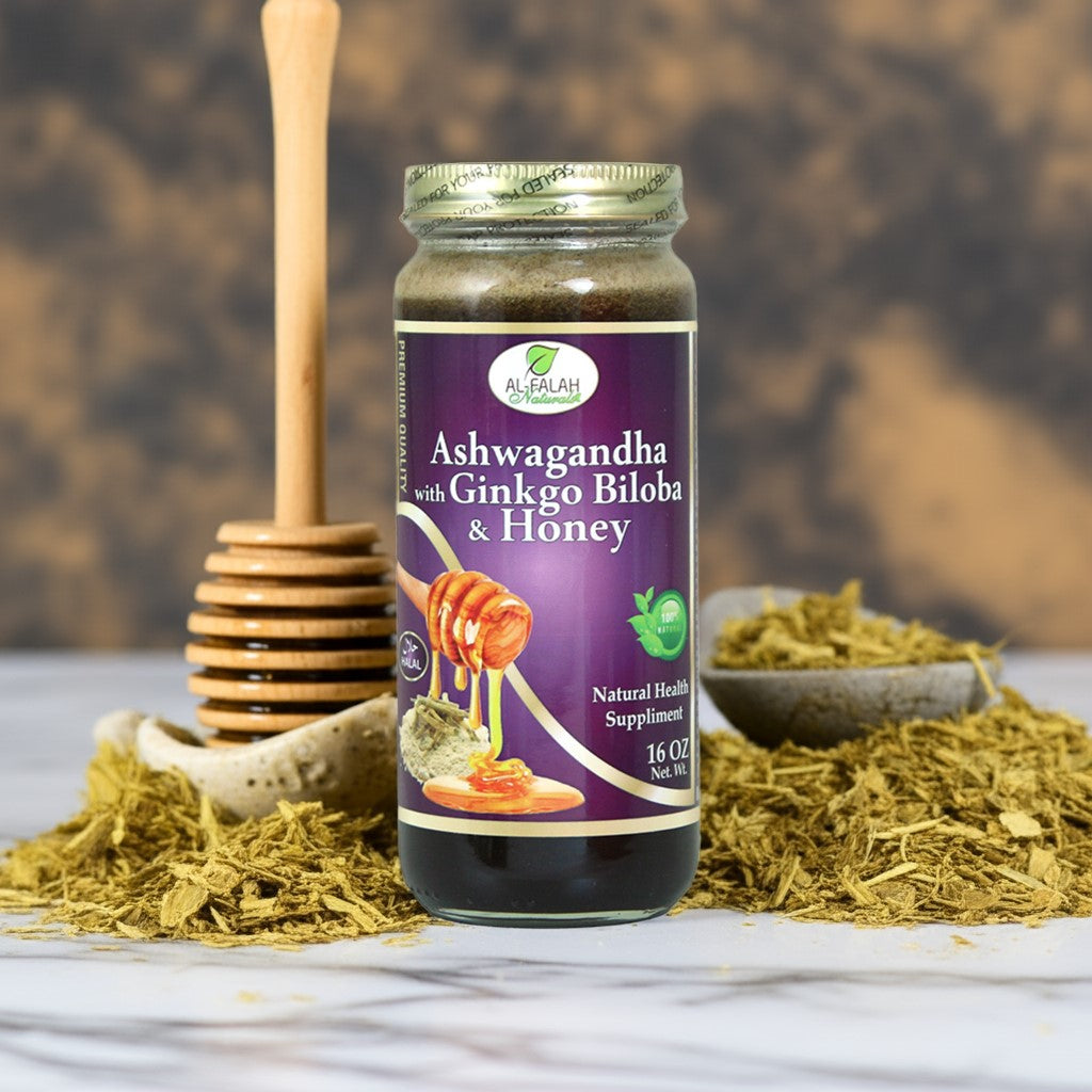 Jar of ashwagandha and ginkgo honey with energizing herbs on marble surface.