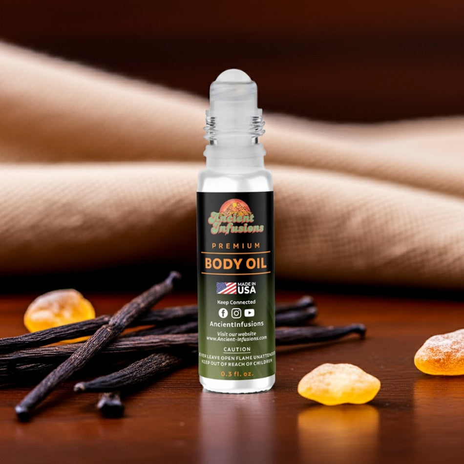 Black Butter body oil bottle with vanilla beans and vanilla flowers on a wooden surface