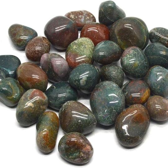 Polished Bloodstone tumbled stones showcasing their deep green and red patterns, highlighting their healing properties and meaning.