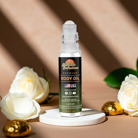 Chanel No 5 Inspired Body Oil on display with roses and gold accents, showcasing luxurious fragrance with elegant jasmine and rose.