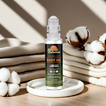 Clean Cotton Body oil bottle on a wooden surface with cotton flowers and towels in the background