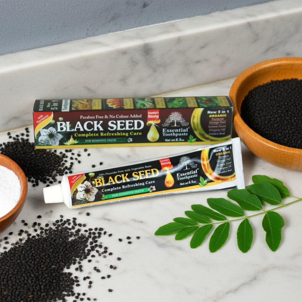 Essential Palace Black Seed 5-in-1 Fluoride-Free Toothpaste with black seeds, moringa, and herbs on marble counter