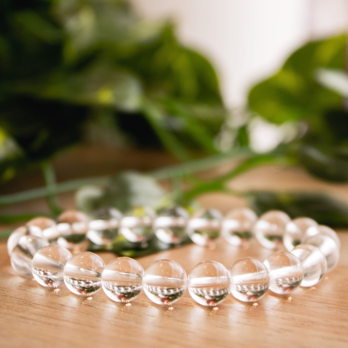 Close-up of Genuine Clear Quartz Beaded Elastic Bracelet – Healing Crystal Jewelry for Clarity and Balance.