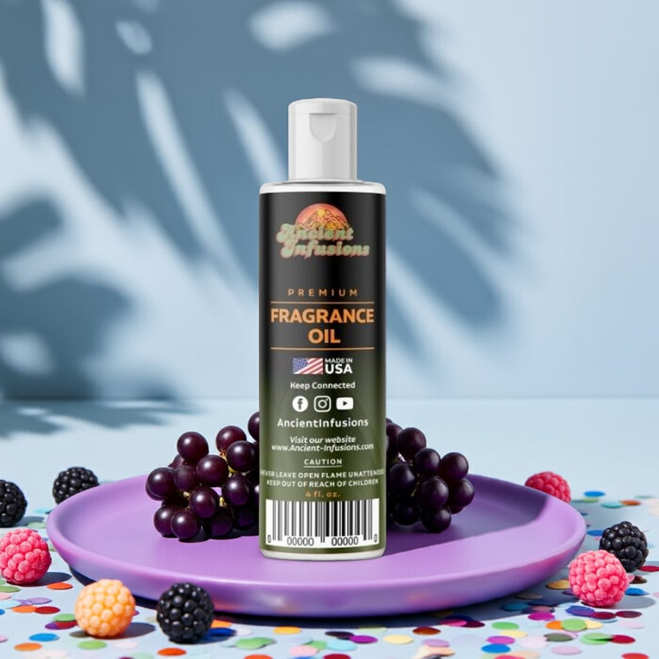 Bottle of Ancient Infusions fragrance oil with grapes and berries on a colorful surface.