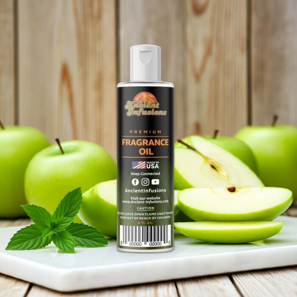 Bottle of Green Apple Fragrance Oil with fresh apples in the background, conveying a crisp, tart, and refreshing scent.