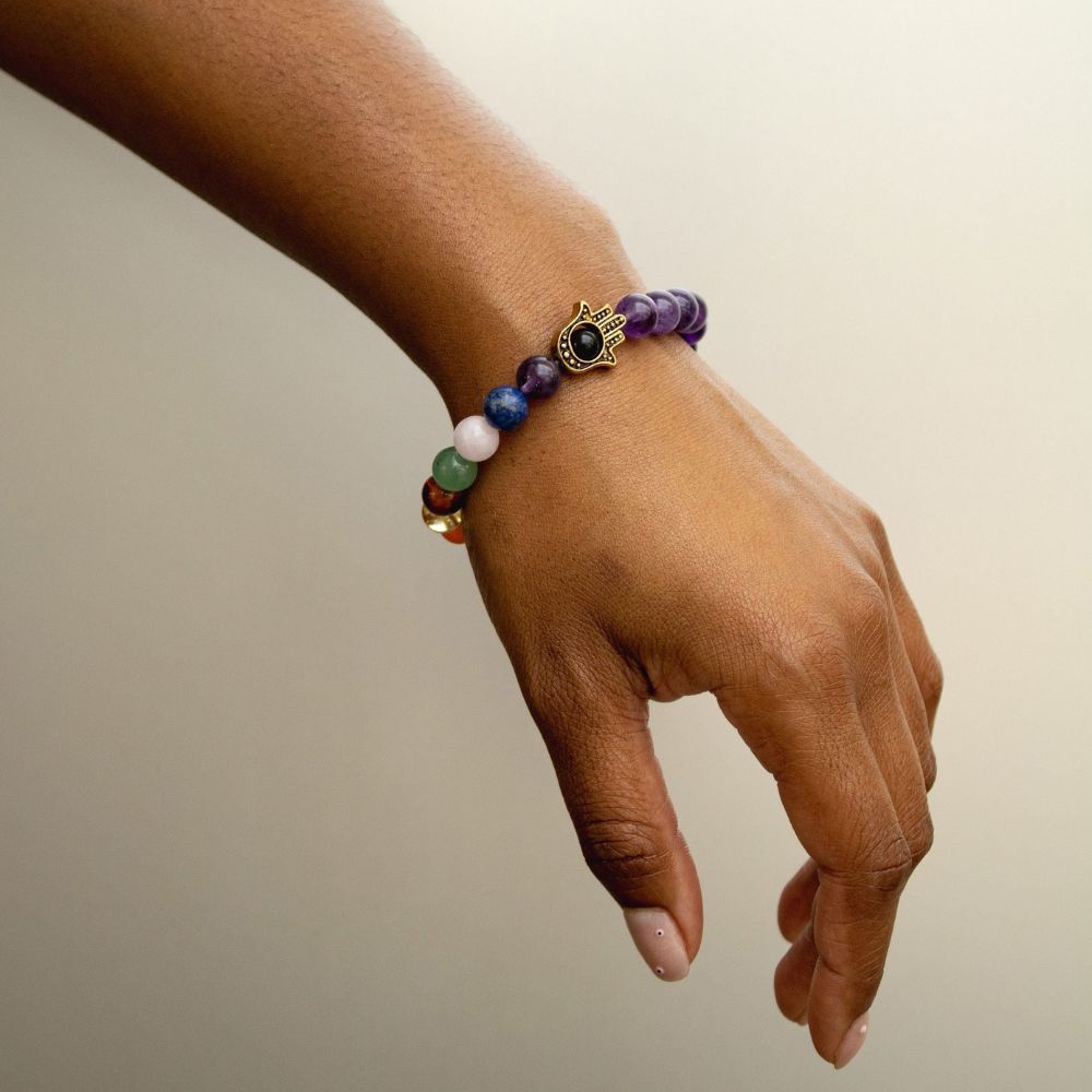Harmony in Hand Crystal Bracelet - Find balance with the fusion of amethyst and the Hamsa hand.