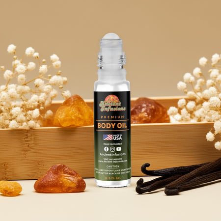 Imported Amber White Body oil bottle with vanilla beans and amber stones on a beige background