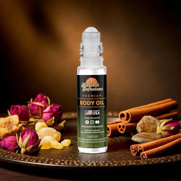 Imported Opium Body Oil with exotic spices and floral elements in a decorative setting