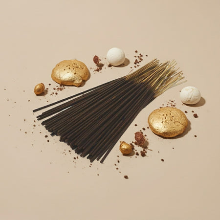 Imported Vanilla Musk Incense Sticks with decorative elements on a beige background
