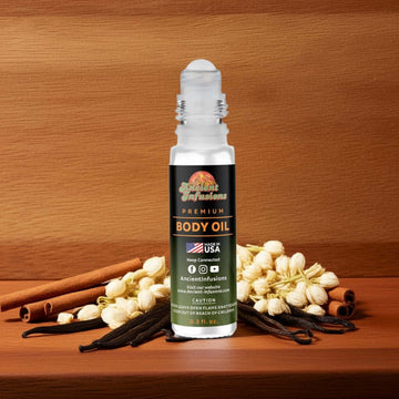 Joop Homme Inspired Body Oil bottle surrounded by cinnamon sticks and vanilla pods