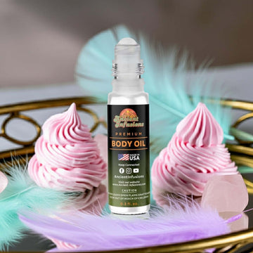 Lattafa Yara Pink Inspired Body Oil roll-on with pink whipped decor and feathers in a luxurious setting.