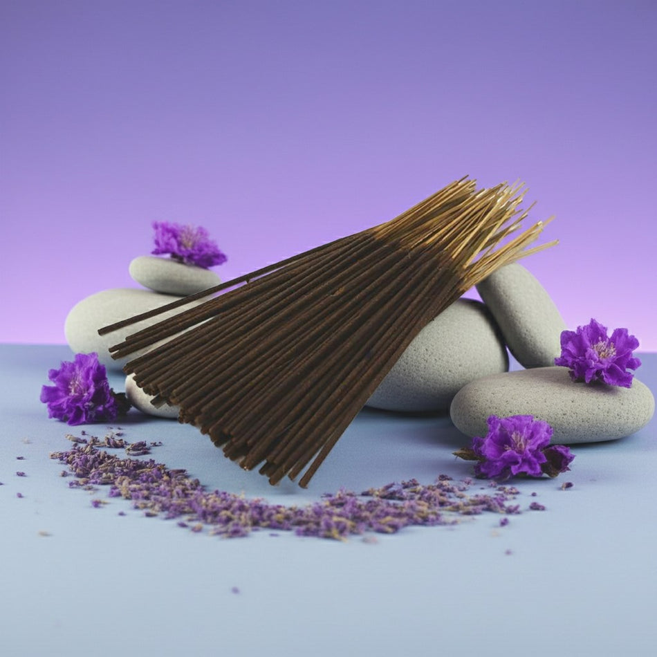 Lavender Incense Sticks with purple flowers and stones on a light blue surface against a purple background