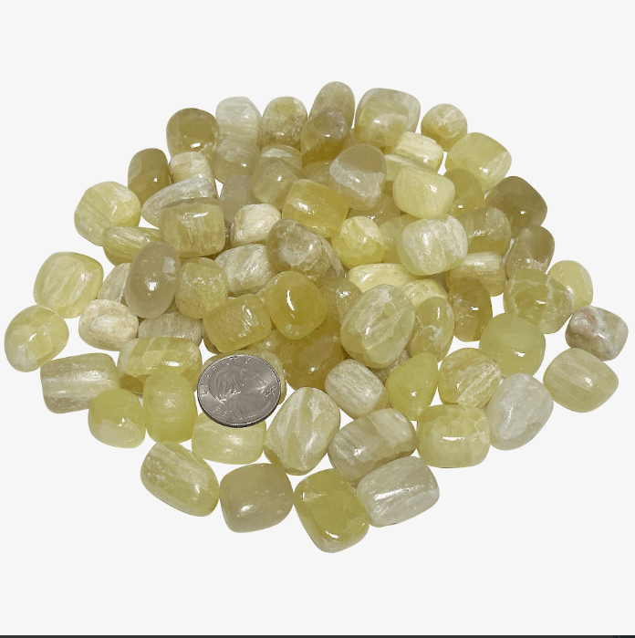 Genuine Lemon Quartz tumbled stones in various shades, showcasing their healing properties and benefits, with a coin for size reference.