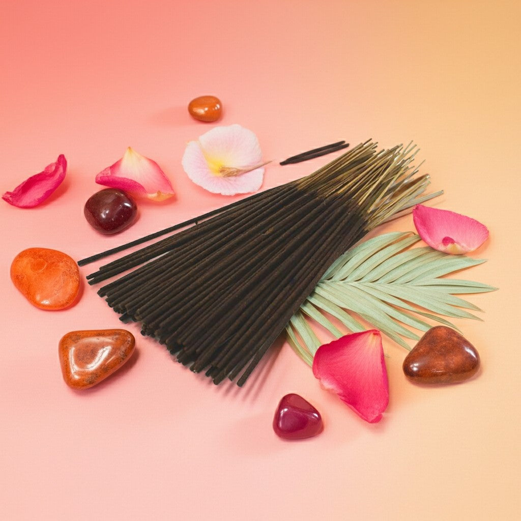 Lick Me All Over Incense Sticks with colorful stones and petals on a pink and orange gradient background