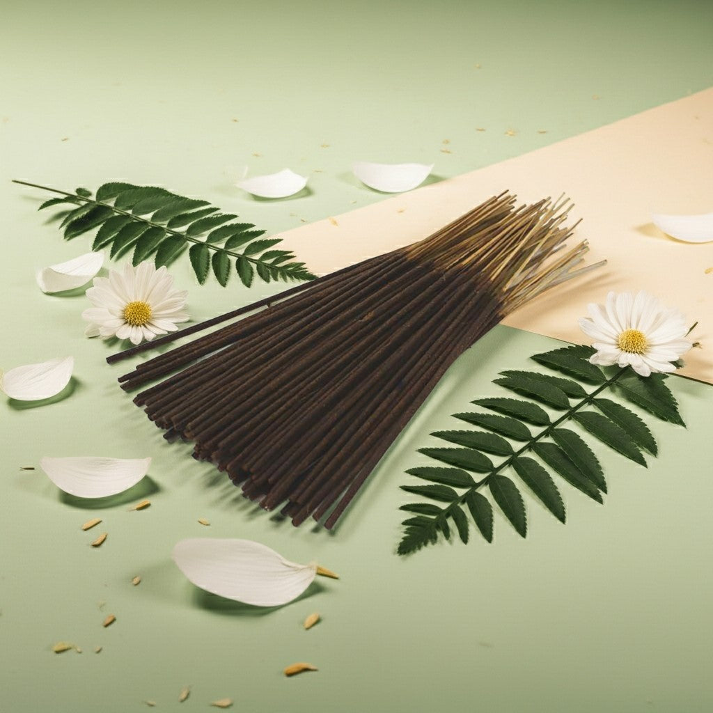 Lily of the Valley Incense Sticks with a pink ribbon on a light background with leaves and petals