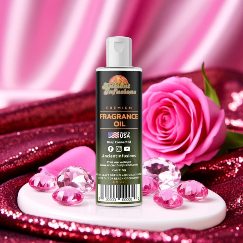 Fragrance oil bottle with pink rose and gemstones on a pink background