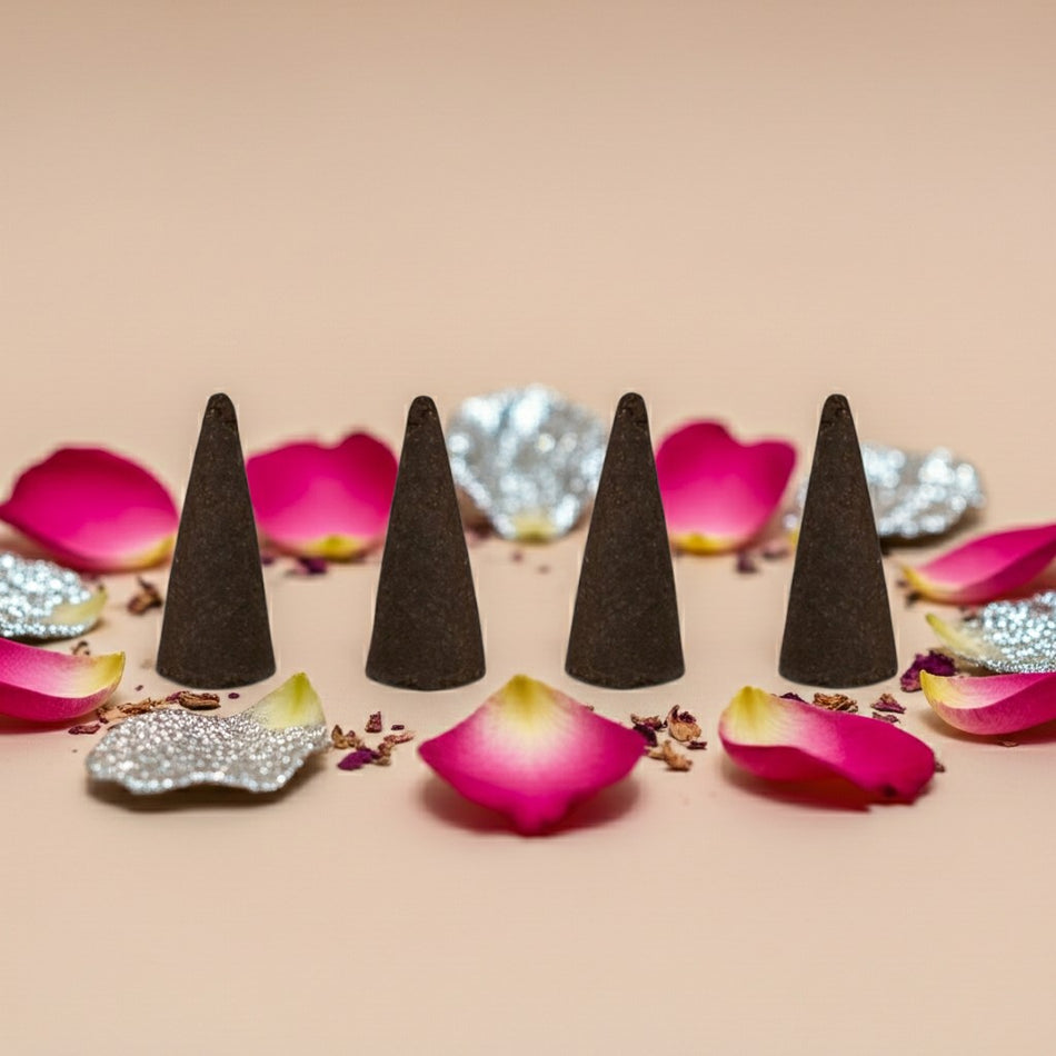 Paris Hilton Pink Rush Inspired Incense Cones on a beige surface with pink flower petals and decorative elements.
