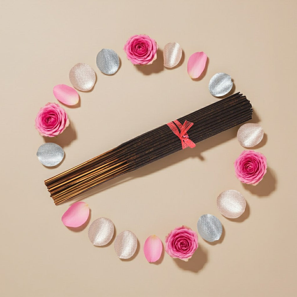 Paris Hilton Pink Rush Inspired Incense Sticks with pink and silver decorative elements on a beige background