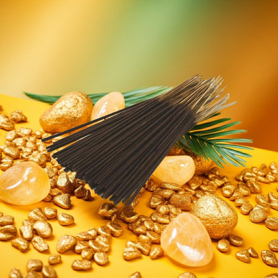 Pineapple Incense Sticks with gold stones and green leaves on a yellow background